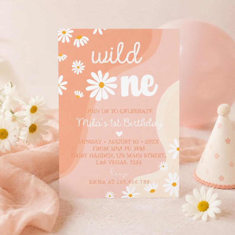 May include: A rectangular birthday invitation card with a peach and cream wavy background featuring white daisy illustrations. The text reads: wild one, JOIN US TO CELEBRATE Mila's 1st Birthday, SUNDAY AUGUST 10 202X FROM 2PM TO 5PM, DAISY GARDEN, 123 MAIN STREET, LAS VEGAS. 1234, RSVP EMMA AT 123.456.789.