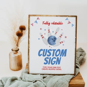 May include: A rectangular sign in a gold frame featuring a watercolor bowling ball and pins graphic. The text reads Fully editable, CUSTOM SIGN, and Type your own text create multiple signs. Red and blue bunting and stars decorate the white background.