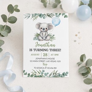 May include: A white birthday invitation card featuring a watercolor koala holding a light blue balloon with the number 3. The text reads: Jonathan IS TURNING THREE! AUGUST 28 AT 2PM JONATHAN'S HOUSE 123 MAIN STREET, LAS VEGAS. 1235 RSVP TO JESSICA AT 123.456.789.