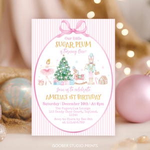 May include: A rectangular birthday invitation card with a light pink and white striped background. It features a pink bow at the top, a ballerina, a Christmas tree, a rocking horse, a nutcracker, and a gingerbread house with text details.