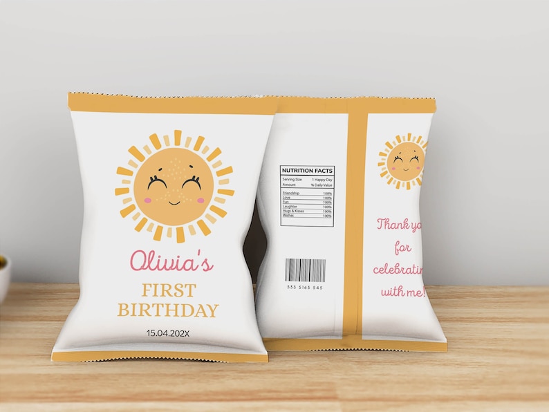 May include: A white chip bag with a yellow border and a smiling sun illustration. The bag says "Olivia's First Birthday 15.04.202X".
