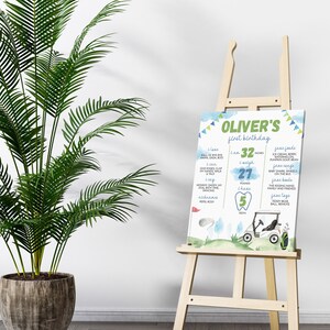 May include: A blue and green printable first birthday milestone chart for a boy named Oliver. The chart features a golf cart, golf balls, and a tooth. It lists milestones such as age, weight, height, words, foods, songs, books, and toys.