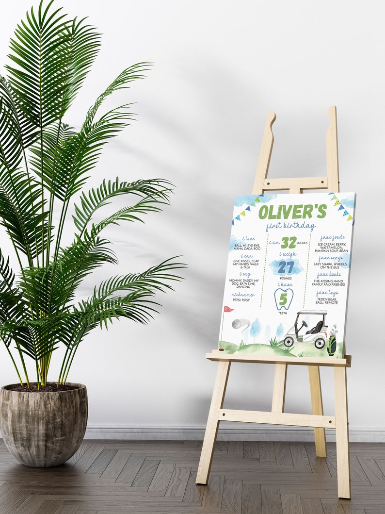 May include: A blue and green printable first birthday milestone chart for a boy named Oliver. The chart features a golf cart, golf balls, and a tooth. It lists milestones such as age, weight, height, words, foods, songs, books, and toys.