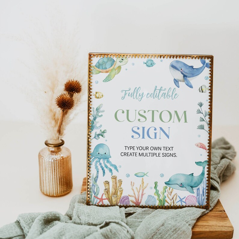 May include: A printable sign with a watercolor design of sea creatures, including a turtle, whale, jellyfish, and coral. The sign says "Fully editable CUSTOM SIGN TYPE YOUR OWN TEXT CREATE MULTIPLE SIGNS."