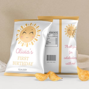 May include: A white chip bag with a gold border and a smiling sun graphic. The bag is personalized with the text "Olivia's First Birthday 15.04.202X".