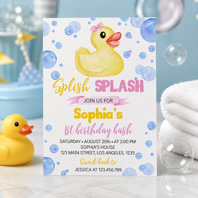 May include: A rectangular invitation card featuring a yellow rubber duck with a pink bow, blue watercolor bubbles, and the text: Splish Splash, Join us for Sophia's 1st birthday bash, Saturday August 20th at 2:00 PM, Sophia's house, 123 Main Street, Los Angeles.