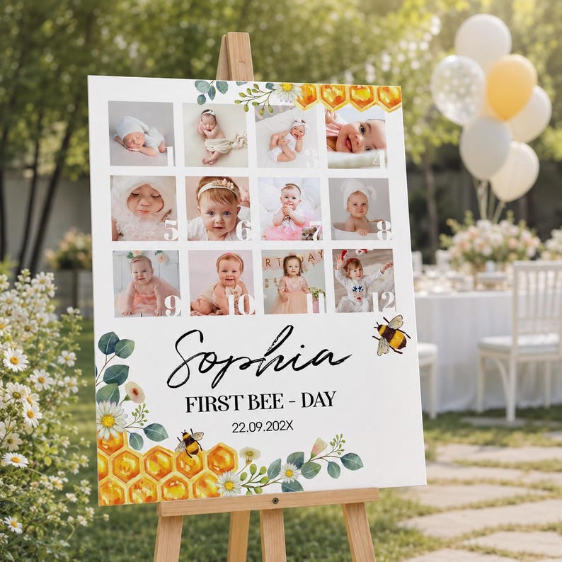 May include: A white rectangular birthday sign featuring a grid of twelve baby photographs, decorated with watercolor honeycomb and daisy illustrations. The text reads Sophia, FIRST BEE - DAY, and the date 22.09.202X, displayed on a wooden easel.
