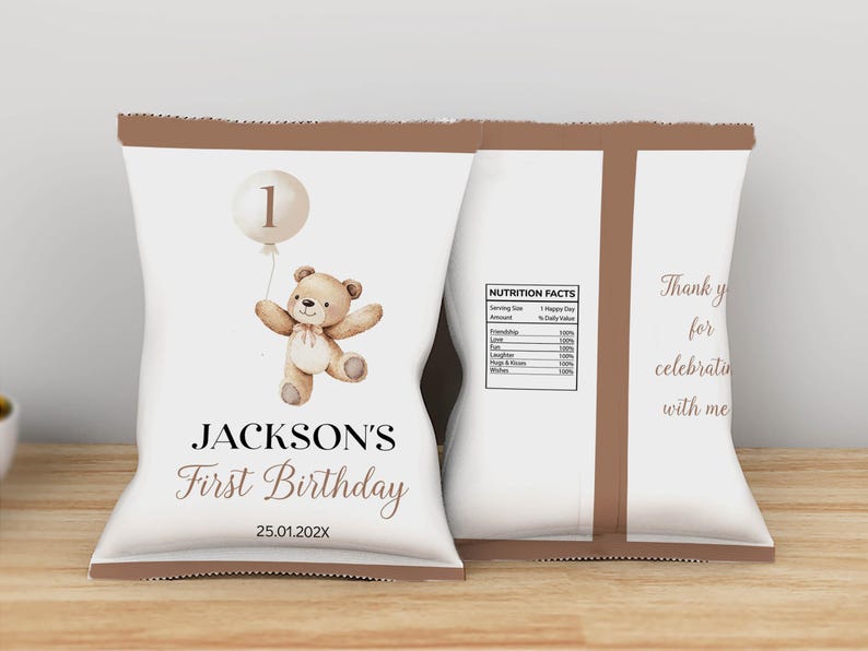 May include: Brown and white personalized chip bag with a teddy bear and balloon illustration. The bag says "Jackson's First Birthday 25.01.202X".