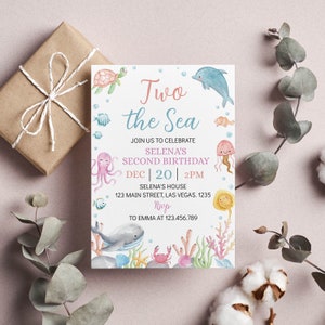May include: A light blue and pink invitation card with a watercolor illustration of sea creatures. The text reads "Two the Sea" and "Selena's Second Birthday" with the date and time of the party.