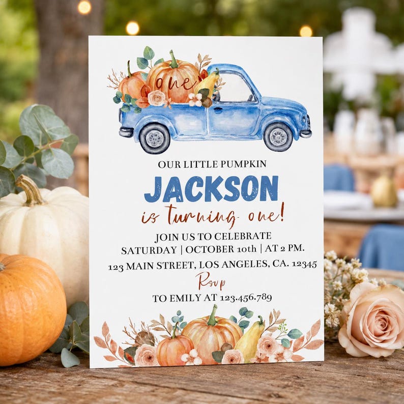 May include: A rectangular invitation card featuring a watercolor blue truck carrying pumpkins. Text reads: OUR LITTLE PUMPKIN JACKSON is turning one! JOIN US TO CELEBRATE SATURDAY | OCTOBER 10th | AT 2 PM. 123 MAIN STREET, LOS ANGELES, CA. 12345 RSVP TO EMILY AT 123.456.789.