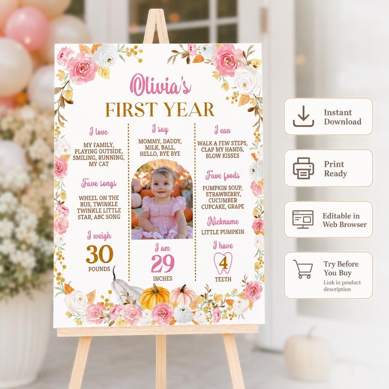 May include: A white milestone birthday sign for Olivia's First Year featuring pink and white floral borders, gold text, and a central photograph of a baby. The sign lists categories including I love, I say, I can, Fave foods, and Fave songs.