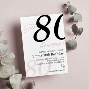 May include: A rectangular birthday invitation card featuring the large black text 80 and the pink script text Shhh... it's a surprise! The card includes details for Emma's 80th birthday celebration on Saturday, October 12th at 5PM at The Flower Garden.