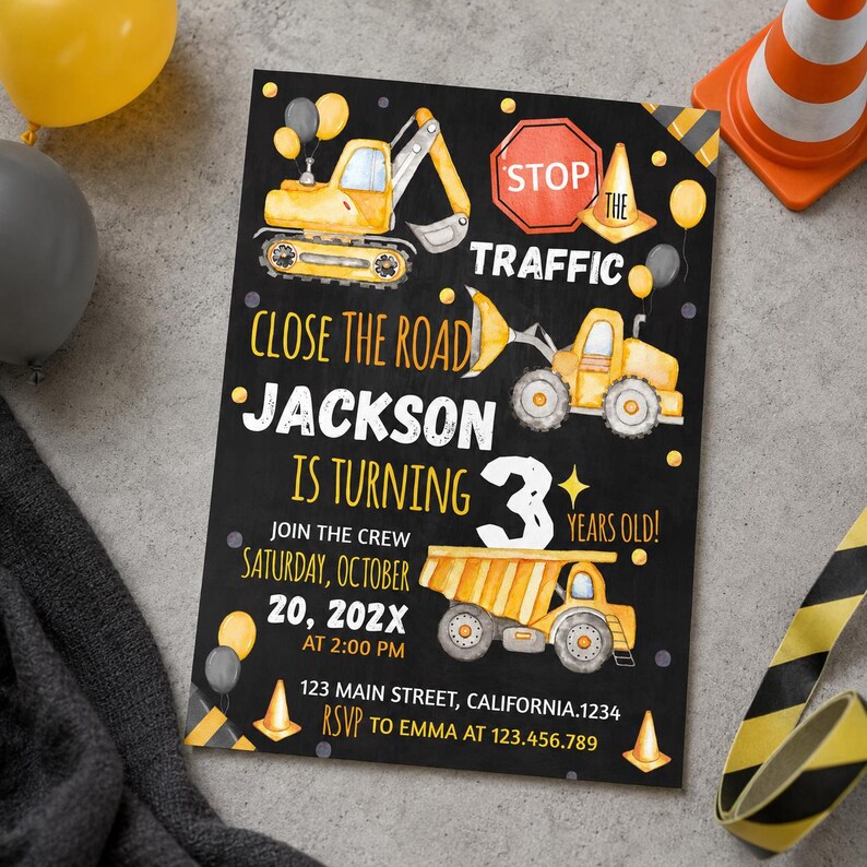 May include: A rectangular birthday invitation card with a black chalkboard background featuring yellow construction vehicles, a red stop sign, and orange traffic cones. Text reads: CLOSE THE ROAD JACKSON IS TURNING 3 YEARS OLD! SATURDAY, OCTOBER 20, 202X AT 2:00 PM 123 MAIN STREET, CALIFORNIA.1234 RSVP TO EMMA AT 123.456.789.
