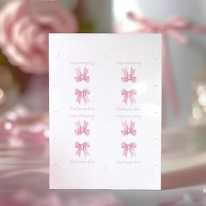 May include: A white rectangular sheet of paper featuring eight individual sections arranged in two columns. Each section displays a watercolor-style illustration of a light pink bow and the placeholder text Food name here in a cursive font.