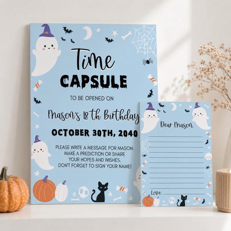 May include: A light blue time capsule sign and matching stationery set featuring Halloween graphics including ghosts, pumpkins, a black cat, bats, and spiderwebs. The text reads Time Capsule to be opened on Mason's 18th Birthday October 30th, 2040.