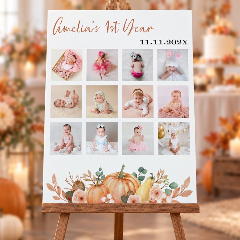 May include: A white rectangular sign on a wooden easel featuring the text Amelia's 1st Year and 11.11.202X. The sign displays a grid of twelve photographs of a baby and is decorated at the bottom with illustrations of pumpkins and flowers.