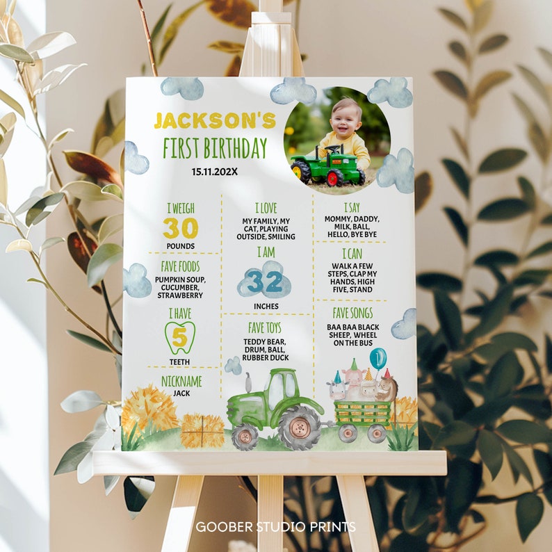 May include: A green and yellow tractor with a farm animal wagon pulls a wagon full of farm animals. The tractor is on a white background with a blue sky and clouds. The text "JACKSON'S FIRST BIRTHDAY 15.11.202X" is at the top of the image. The image also includes a photo of a baby boy in a red shirt and blue jeans. The text "I weigh 30 pounds" is in a green box. The text "I love my family, my cat, playing outside, smiling" is in a green box. The text "I say mommy, daddy, milk, ball, hello, bye bye" is in a green box. The text "I am 32 inches" is in a green box. The text "I can walk a few steps, clap my hands, high five, stand" is in a green box. The text "Fave foods pumpkin soup, cucumber, strawberry" is in a green box. The text "Fave toys teddy bear, drum, ball, rubber duck" is in a green box. The text "Fave songs baa baa black sheep, wheel on the bus" is in a green box. The text "I have 5 teeth" is in a green box. The text "Nickname Jack" is in a green box.