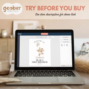 May include: A laptop screen displaying a digital design interface with a birthday sign template. The template features a brown teddy bear holding a balloon with the number 1, and text reading Welcome to, Jackson's BEAR-Y FIRST BIRTHDAY, 25.02.202X.