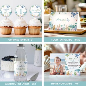 May include: Under the sea themed printable party decorations for a first birthday. Includes cupcake toppers, food tent cards, water bottle labels, and thank you cards. The designs feature a blue whale, coral, and other sea creatures. The text on the cards says "Amelia's First Birthday" and "Thank You".