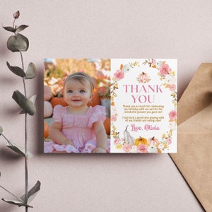 May include: A rectangular thank you card featuring a photograph of a smiling child in a pink dress on the left and a floral pumpkin wreath design on the right. The text reads: THANK YOU, Thank you so much for celebrating my birthday with me and for the wonderful present you gave me! I had such a good time playing with all my friends and eating cake! Love, Olivia.