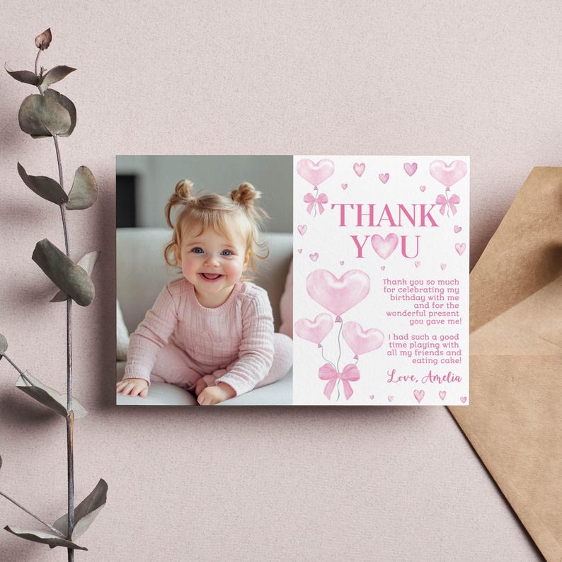 May include: Pink thank you card with a photo of a young girl and pink heart balloons. The text reads "Thank You" and "Thank you so much for celebrating my birthday with me and for the wonderful present you gave me! I had such a good time playing with all my friends and eating cake. Love, Amelia."