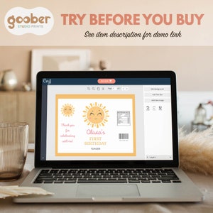 May include: A laptop screen displaying a digital design template for a birthday party favor. The design features a yellow sun with a smiling face and the text "Olivia's First Birthday 15.04.202X".