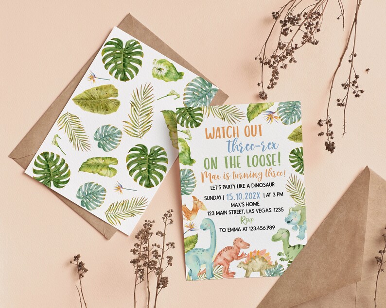 May include: A rectangular invitation card and a matching envelope liner featuring watercolor illustrations of green tropical leaves and colorful dinosaurs. The text reads: WATCH OUT three-rex ON THE LOOSE! Max is turning three! LET'S PARTY LIKE A DINOSAUR.