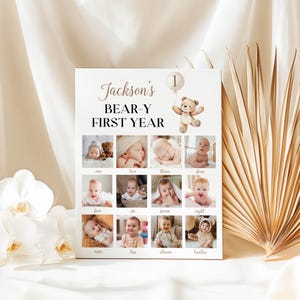 May include: A white poster with the text "Jackson's BEAR-Y FIRST YEAR" and a teddy bear holding a balloon. The poster has 12 photos of a baby boy, each photo representing a month of the year.