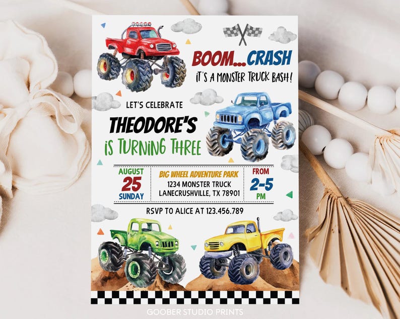 May include: A colorful invitation for a monster truck themed birthday party. The invitation features a watercolor illustration of four monster trucks, with the text "BOOM...CRASH IT'S A MONSTER TRUCK BASH!" and "Let's Celebrate Theodore's is Turning Three". The invitation also includes details about the party, such as the date, time, and location.
