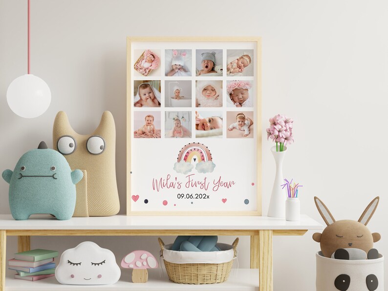 May include: A rectangular framed photo collage featuring twelve individual baby photographs arranged in a grid. Below the photos is a watercolour rainbow illustration, the text "Mila's First Year," and the date "09.06.202x" with small heart and dot accents.