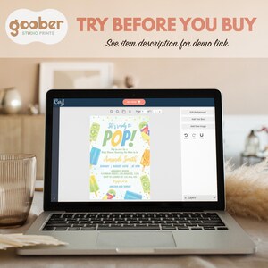 May include: A laptop screen displaying a digital baby shower invitation template with popsicle graphics and the text She's ready to POP! The invitation includes placeholders for event details like name, date, time, location, and registry information.