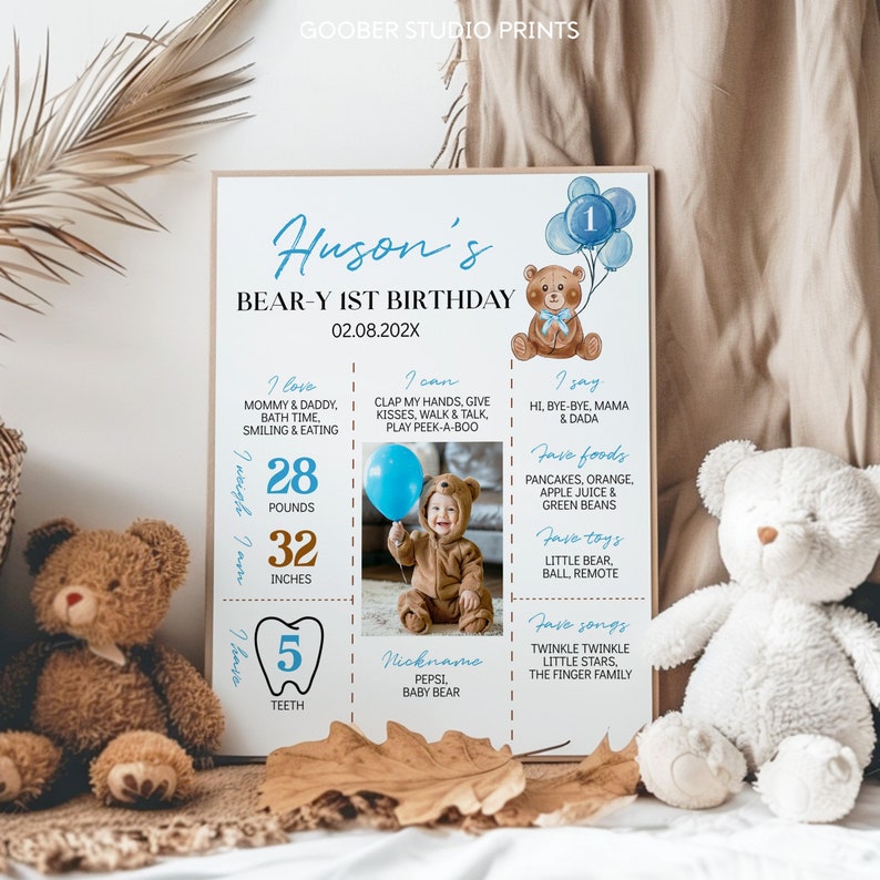 May include: A rectangular birthday milestone poster featuring a brown teddy bear illustration, blue balloons, and text including Huson's Bear-y 1st Birthday, 02.08.202X, 28 pounds, 32 inches, 5 teeth, and a central photograph of a child in a bear costume.