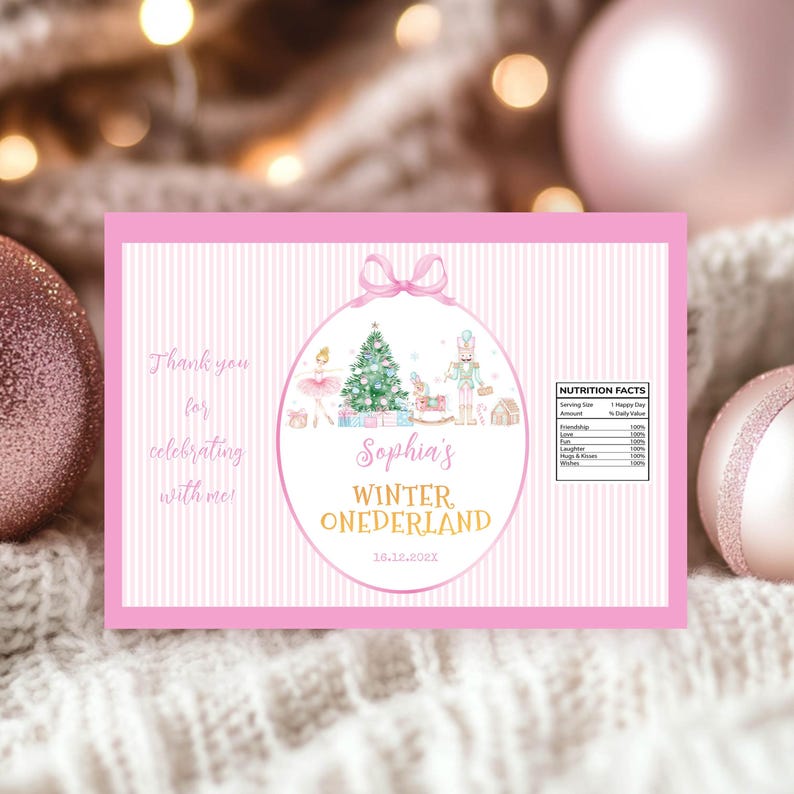 May include: A rectangular pink and white striped label featuring a central oval with a ballerina, Christmas tree, and nutcracker. Text reads: Thank you for celebrating with me!, Sophia's WINTER ONEDERLAND, 12.12.202X, and a Nutrition Facts table.