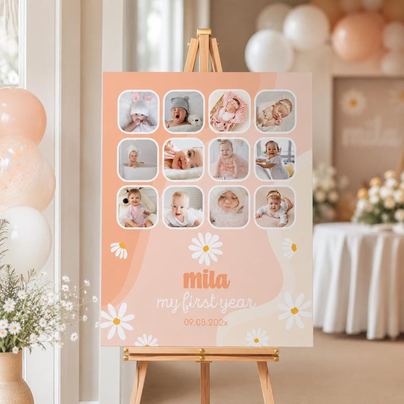 May include: A peach-colored sign on a wooden easel, featuring a collage of baby photos in square frames. The sign includes the text "mila my first year" with a daisy graphic and the date 09.03.202x.