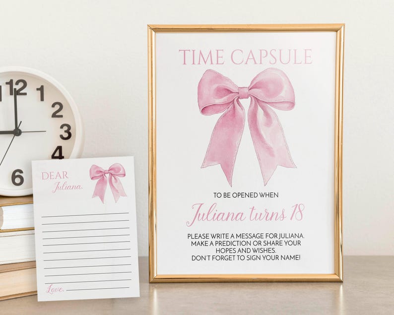 May include: A pink and gold time capsule card with a pink bow and the text "Time Capsule" and "Juliana turns 18". The card includes instructions to write a message for Juliana, make a prediction, or share hopes and wishes.  The card also includes a blank card with the text "Dear Juliana" and "Love".