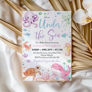 May include: A rectangular baby shower invitation card featuring watercolor illustrations of a purple octopus, a green jellyfish, a pink whale, a sea turtle, and a seahorse. The text reads Under the Sea for a Baby Shower honoring SAMANTHA GREEN on SUNDAY APRIL 20TH AT 2 PM.