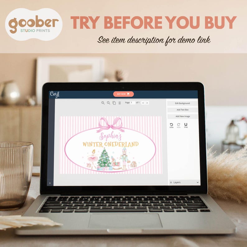 May include: A laptop screen displaying a digital design editor interface. The design features a pink and white striped background with a pink oval frame, a bow, and text reading Sophia's WINTER ONEDERLAND, with illustrations of a tree and nutcracker.