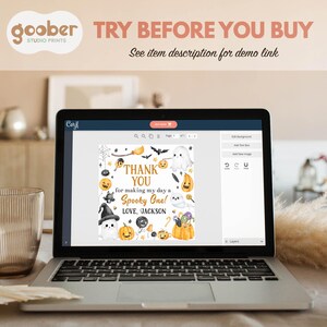 May include: A laptop displays a Halloween-themed invitation design. The design features pumpkins, ghosts, bats, and the text "THANK YOU for making my day a Spooky One! LOVE, JACKSON." The top of the screen reads "TRY BEFORE YOU BUY."