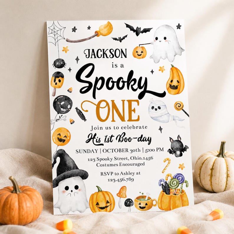 May include: A white rectangular invitation card featuring watercolor Halloween illustrations including ghosts, pumpkins, bats, and a spiderweb. The text reads: JACKSON is a Spooky ONE Join us to celebrate His 1st Boo-day SUNDAY | OCTOBER 30th | 5:00 PM.