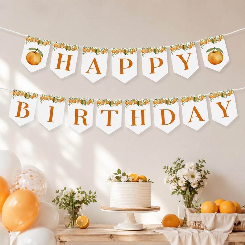 May include: A two-row pennant banner featuring white triangular flags with orange letters spelling out HAPPY BIRTHDAY. Each flag is decorated with a watercolor illustration of oranges and green leaves along the top edge, strung on white cord.
