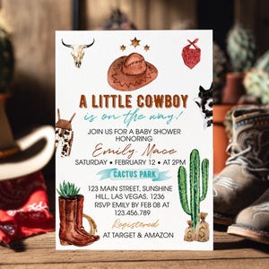 May include: A white baby shower invitation card featuring watercolor illustrations of a brown cowboy hat, a skull, a red bandana, brown boots with a succulent, a green cactus, and money bags. The text reads A LITTLE COWBOY is on the way! for Emily Mace.