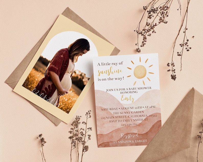 May include: A baby shower invitation with a watercolour background in shades of brown and orange. The invitation features a sun graphic and the text "A little ray of sunshine is on the way!"  Join us for a baby shower honouring Emily. Saturday, August 12th at 2 pm. The Sunny Garden, 123 Main Street, California, 19345. RSVP to Emily Smith at 123-456-7890. Registered at Amazon & Target.
