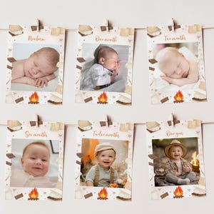 Op de afbeelding: Een set van zes printbare kaarten met een kampvuur- en marshmallowthema. Elke kaart heeft een andere mijlpaal in de leeftijd, van pasgeborene tot een jaar, met een fotoplekhouder voor elke leeftijd. De kaarten zijn versierd met een kampvuur, marshmallows en graham crackers.