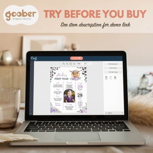 May include: A laptop screen displaying a customizable first birthday milestone board template featuring a highland cow illustration, purple floral accents, cow print borders, and text fields for baby details including weight in pounds and height in inches.
