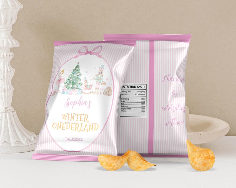 May include: Two custom chip bags with light pink vertical stripes. The front features a watercolor illustration of a Christmas tree, nutcracker, and ballerina, with the text Sophia's WINTER ONEDERLAND and 16.12.2021. The back shows a nutrition facts label.