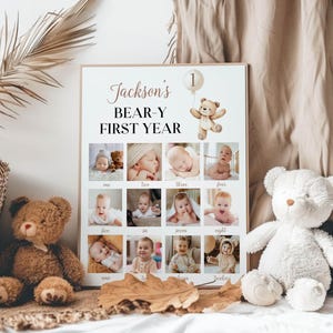 May include: A beige poster with the text "Jackson's BEAR-Y FIRST YEAR" and a teddy bear holding a balloon with the number "1" on it. The poster has 12 photos of a baby boy in a grid layout, each photo labelled with a number from one to twelve.