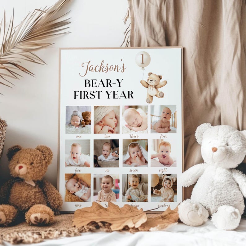 May include: A beige poster with the text "Jackson's BEAR-Y FIRST YEAR" and a teddy bear holding a balloon with the number "1" on it. The poster has 12 photos of a baby boy in a grid layout, each photo labelled with a number from one to twelve.