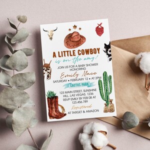 May include: A rectangular baby shower invitation card featuring watercolor illustrations of a brown cowboy hat, a cow skull, a red bandana, brown boots with a succulent, a green cactus, and money bags. The text reads A LITTLE COWBOY is on the way!