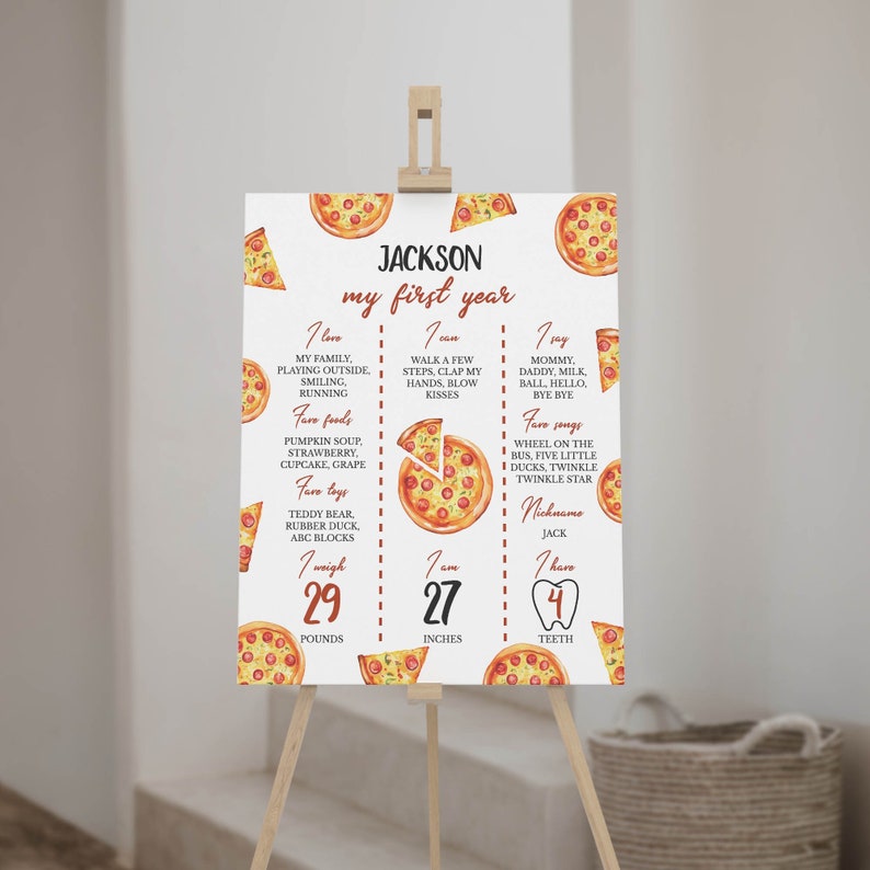 May include: A white printable poster with a pizza theme for a baby's first birthday. The poster has a red and white striped border and includes the baby's name, age, weight, height, and favorite foods, toys, and songs. The poster is decorated with illustrations of pizzas.