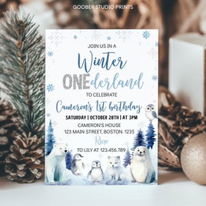 May include: A rectangular invitation card with a white background featuring blue snowflakes, dark blue pine trees, and illustrations of a polar bear, two penguins, an arctic fox, and a seal. Text reads: Winter ONEderland, Cameron's 1st birthday.